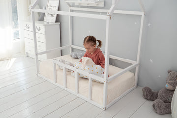 How to create a safe and comfortable environment for a child transitioning from a crib to a stable bed?